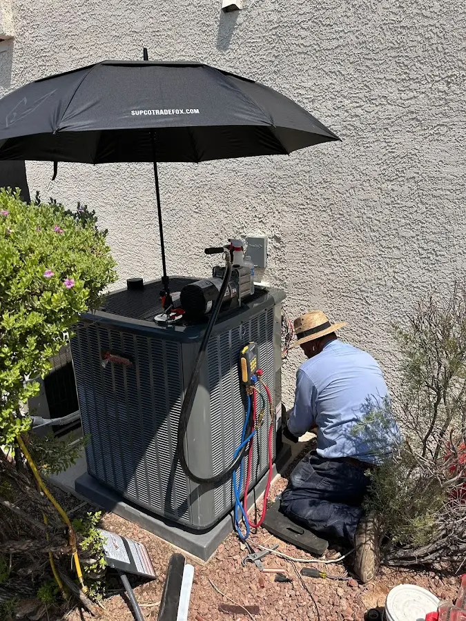 HVAC technician performing outdoor AC maintenance in Lower Nazareth
